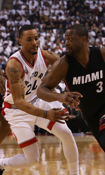 Heat survive halfcourt heave to hold off Raptors in OT
